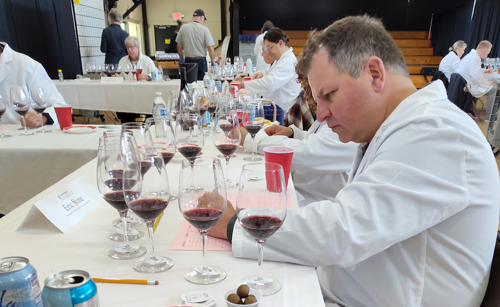 Eric Stine, one of the judges at the San Francisco Chronicle Wine Competition, evaluates a group of reds. Bob Ecker